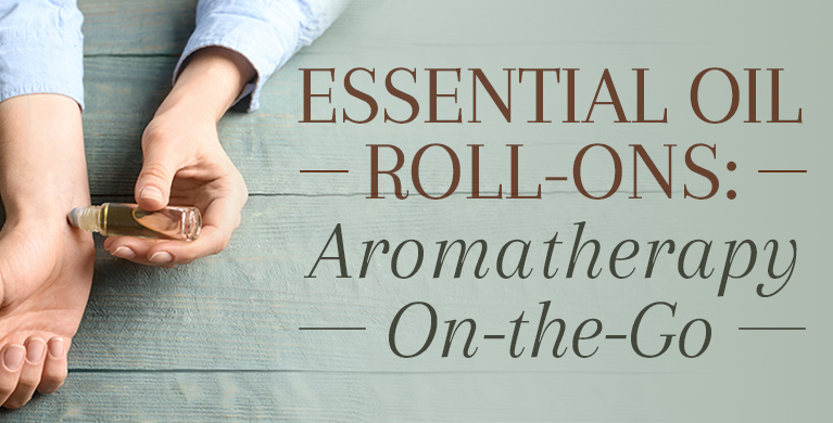 A person using a essential oil roll-on on their wrist for aromatherapy on-the-go.